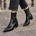 Botines negros de punta fina con cremallera trasera